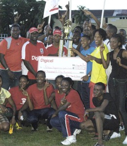 Former Junior Sprinter, Gavin Hope, (standing second, left) presents one of the team’s cheques to Police Progressive Youth Club yesterday.