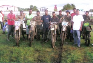 Some of the riders pose with their machines  moments after completing a training session.