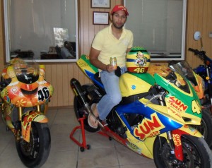 Caribbean Super Bike champion Stephen Vieira poses atop his 2008 Suzuki GSX-R 600cc machine at the Continental Group of Companies Head Office. 