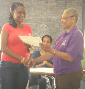 One of the participants receives her certificate from the President-Elect of the Rotary Club of Georgetown Central, Mrs. Gail Robinson (right).