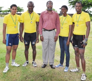 GCF President Hector Edwards pose with the 2010 National Champions from right, Warren Mc Kay, Hazine Barratt, Gary Benjamin and Christopher Holder.