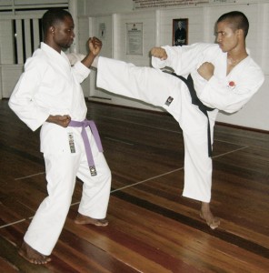 Marlon George (left) and Kevin Chin engaging in kumite during their training session.
