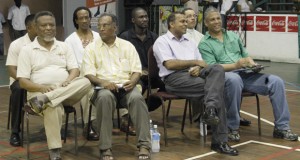 Prime Minister, Samuel Hinds (left) is joined by, from left, Director of Sport, Neil Kumar, Minister of Culture, Youth and Sport, Dr. Frank Anthony and Banks DIH Executive, Carlton Joao in the front row while other officials, seated behind, share the moment at the Opening Ceremony of the National Schools’ Basketball Festival yesterday.