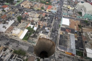 An overhead view of the giant sinkhole which swallowed an entire intersection in Guatemala City.