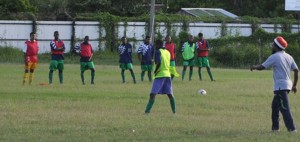 Head Coach of the National Under-17 team Sampson Gilbert (centre)  taking his charges through their paces at the Tucville Ground. 