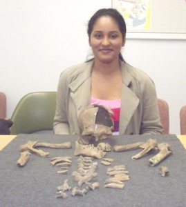 A smiling Louisa displays an intriguing skeletal remains find. The remains were uncovered at Siriki, Rupununi, and are stored safely at the Walter Roth Museum of National Anthropological Archives, in hopes of conducting further analysis.