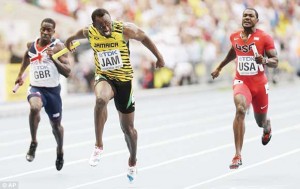 Usain Bolt (centre) and Jamaica win another gold in the 4x100m, ahead of Justin Gatlin (right) and Dwain Chambers (left) as they chase him down. (AP)