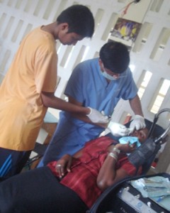  Dr. Reddy with one of his patients during the last outreach 