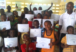 President of CRBFC, Rollin Tappin (extreme right) share a moment with participants displaying their certificates.