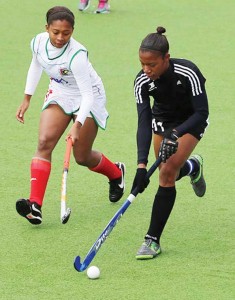 Guyana’s Aliyah Gordon (left) applies pressure on Trinidad and Tobago’s Captain Allana Lewis during the clash for the 7th and 8th places.