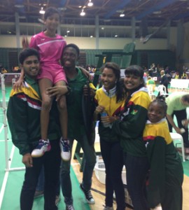 Priyanna Ramdhani is hoisted aloft by her teammates following clinching gold for Guyana.