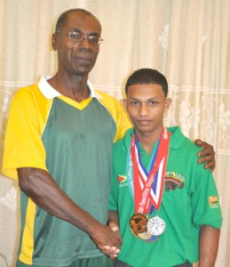 Coach Egbert Jackson and World Champion Gumendra Shewdas. 