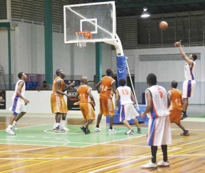 Alberttown/Bourda’s forward, Yannick December pulls up for a baseline jumper against Melanie Saturday night at the Cliff Anderson Sports Hall. 