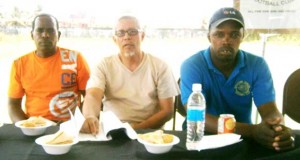 Newly elected President of the Western Tigers Football Club, Roger Moe (right) pose with Anthony Stanton (left) and Allan Walker shortly after the conclusion of the elections process.