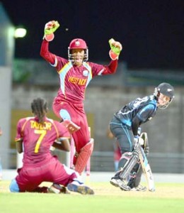 Stafanie Taylor (on the ground) takes a  catch to dismiss Katie Perkins. (WICB)