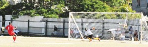 Delroy Fraser scores his penalty kick for Rosignol yesterday. 