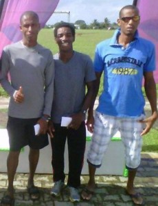 Kelvin Johnson (centre) pose with Lionel D’Andrade (right) and Curtis Cox after receiving their prizes in Trinidad and Tobago.