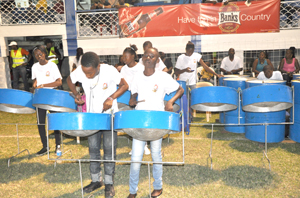 Members of the Dolphin Secondary School Steel Orchestra entertains the fans with a rendition of a Christmas carol on Saturday.
