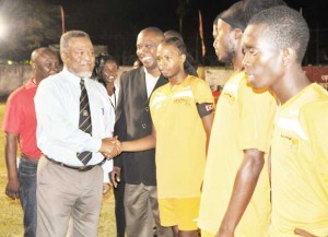 Prime Minister Samuel Hinds being introduced to the Captain of Sunburst Camptown in the presence of Guyana Football Federation President Christopher Matthias on Saturday.