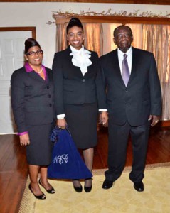 Mr. Christie and his wife with one of their daughters, Naomi, when she was admitted to the Bar last month in Berbice.