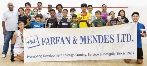 Farfan and Mendes Squash winners display their prizes.
