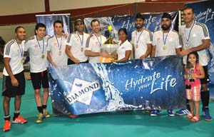 Men’s champions Revamp of Canada pose with Diamond Mineral Water representative and their hardware during the presentation ceremony on Sunday evening at the National Gymnasium.