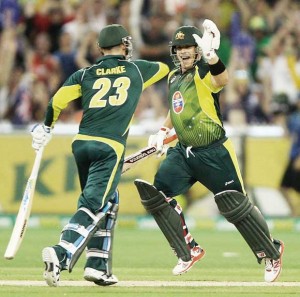Aaron Finch gets a high five from Michael Clarke as he completes his hundred (Getty Images)