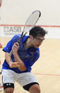 Guyana’s Alex Arjoon attempts a backhand return during a match.