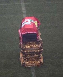 The football legend’s coffin was placed on a golden plinth at the centre of the pitch. (AP)