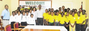 Minister of Sport Dr. Frank Anthony (left), PS King (centre) pose with the two teams during a courtesy call at the Ministry in 2010.