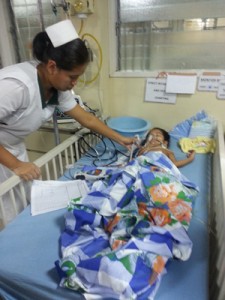 A nurse attending to Rehanna Edwin yesterday at the hospital.