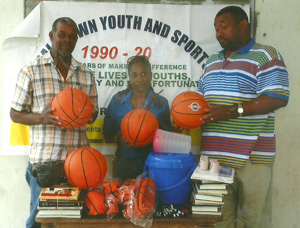 Secretary/CEO of the RHTY&SC Hilbert Foster (right) hands over the equipment to BABA President Keith Myers (left) and Secretary Petra Forde.