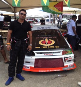 Reigning Group 2B champion Afraz Allie poses next to his Toyota Starlet at the 2013 CMRC in Jamaica. 