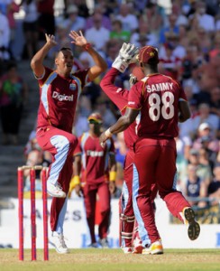 Badree celebrates the wicket of Wright