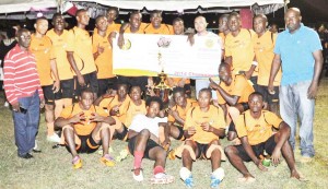 The triumphant Slingerz Football Club team and club officials pose with the ceremonial cheque following the presentation after the competition on Saturday night.  