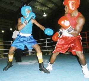 Barbadian pugilist, Jabali Breedy (right) steps out of range of April’s left jab during the early stages of the bout.