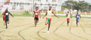 Jason Yaw (centre) proved too strong for his rivals in the boys 200m U-18. 