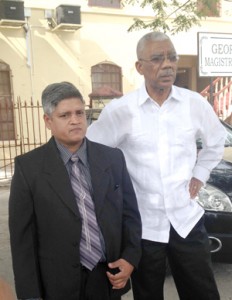 APNU Member of Parliament Jaipaul Sharma with Opposition Leader David Granger yesterday.