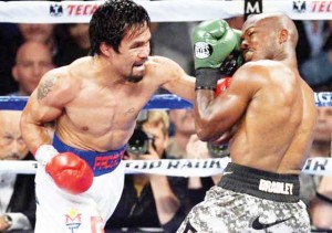 Timothy Bradley (right) and Manny Pacquiao box during their WBO World Welterweight Title bout at MGM Grand Garden Arena. Pacquiao won via unanimous decision. (Joe Camporeale-USA TODAY Sports)