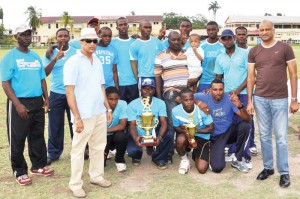  We are the Champions! TSU with sponsor ‘Anand’ Coober Persaud and Commissioner of Police (Acting) Seelall Persaud (right) celebrate their title yesterday.