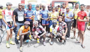 Banks DIH Marketing Manager Jennifer Khan congratulates race winner Orville Hinds as another Banks DIH Manager Mortimer Stewart (2nd left standing), riders and officials share this Kodak moment.  