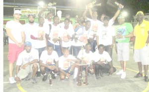 Champions Mackenzie High celebrate after taking title number five with United States based sponsors, including Linden Alphonso (right).
