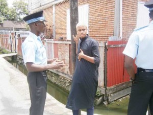  Police officers engage a youth in dialogue about the project.