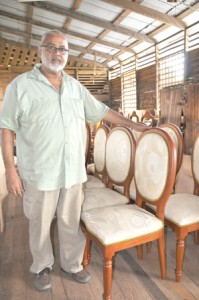 Mohamed Alli with chairs made by his establishment.