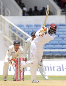 Chris Gayle hits down the ground.