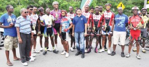 Castrol’s Junior Rampersaud (centre) and race officials pose with recipients of prizes following yesterday’s presentation. 