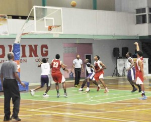 National youth player Jonathon Pooran sinks a basket during his game high 19 points for UG against PC in Saturday night action.