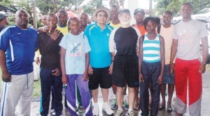 The athletes from the winning Running Brave Athletics Club pose with GOA President, K. A. Juman Yassin and Mexican Ambassador to Guyana, Fransico Olguin (centre) along with Coach, Julian Edmonds (left) at the YMCA yesterday morning.