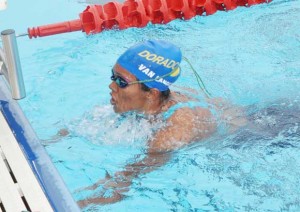 Britany van Lan completing  victory in the 100m butterfly 