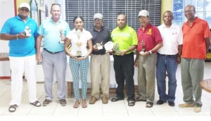 From left: Troy Cadogan, William Walker, Joaan Deo, Bolaram Deo, David Mohamad,  Colin Ming, Mr. Charles Clarke and Mr. Maurice Solomon at the presentation.
